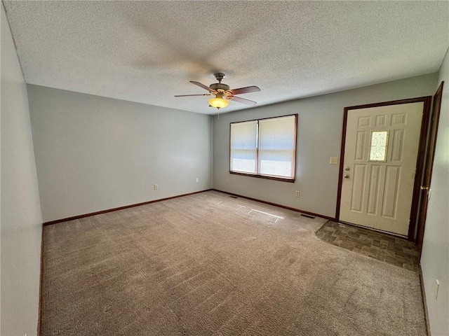 177 SE 411th Rd, Warrensburg, MO 64093 - entryway with light carpet, a ceiling fan, and a textured ceiling