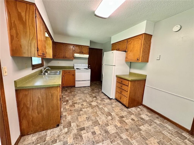 177 SE 411th Rd, Warrensburg, MO 64093 - kitchen with white appliances, a textured ceiling, brown cabinetry, under cabinet range hood, and stone finish floors