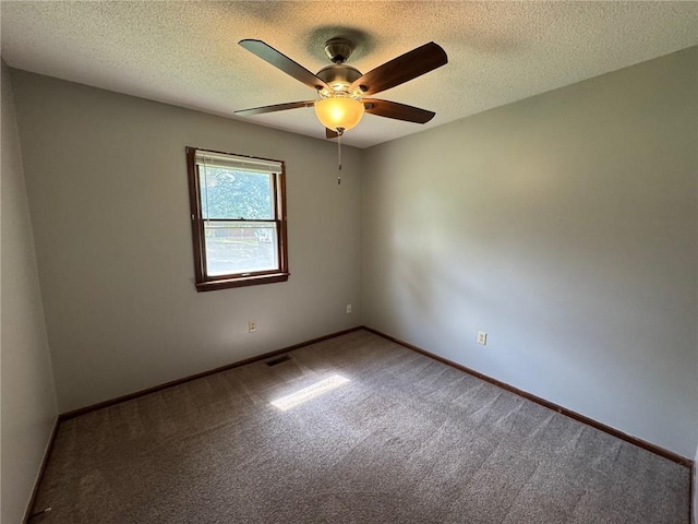 177 SE 411th Rd, Warrensburg, MO 64093 - unfurnished room featuring carpet floors, a ceiling fan, and a textured ceiling