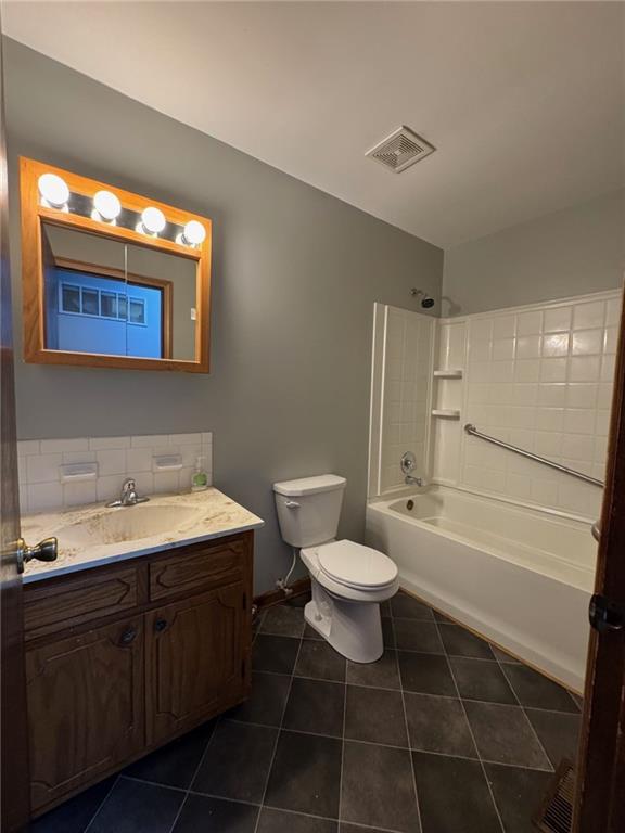 177 SE 411th Rd, Warrensburg, MO 64093 - full bathroom featuring vanity, tile patterned floors, and bathtub / shower combination