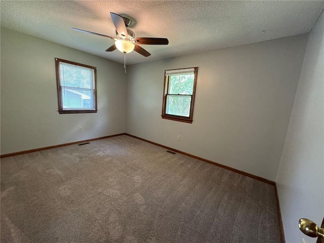 177 SE 411th Rd, Warrensburg, MO 64093 - empty room featuring carpet flooring, ceiling fan, and a textured ceiling