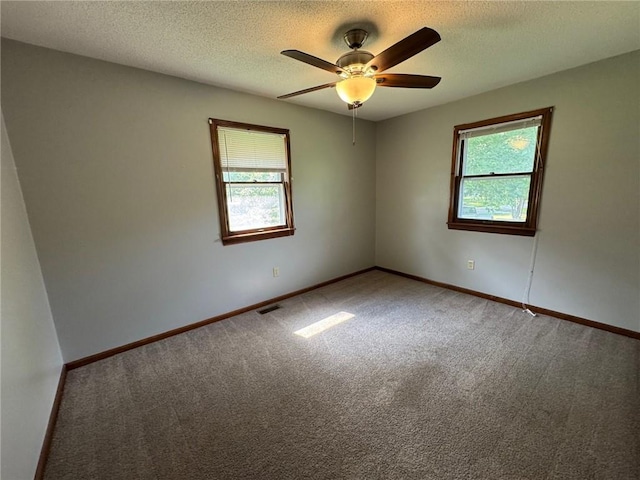 177 SE 411th Rd, Warrensburg, MO 64093 - carpeted spare room with a ceiling fan and a textured ceiling