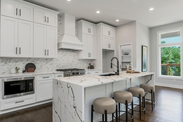2201 W 74th St, Prairie Village, KS 66208 - kitchen with custom range hood, built in microwave, backsplash, dark wood-style floors, and recessed lighting