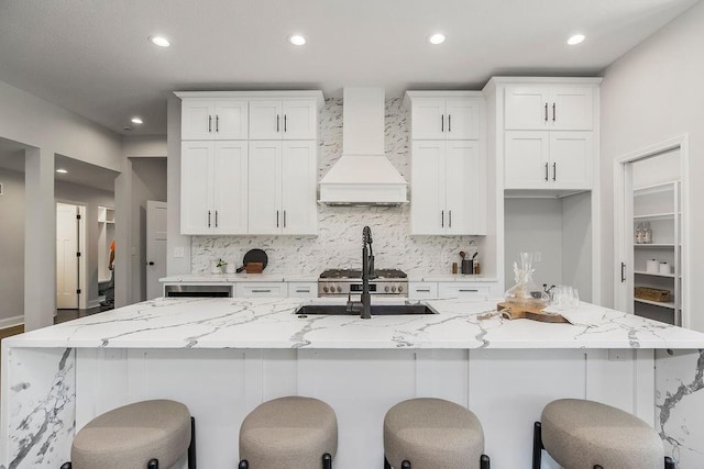 2201 W 74th St, Prairie Village, KS 66208 - kitchen featuring premium range hood, decorative backsplash, white cabinetry, and recessed lighting