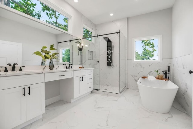 2201 W 74th St, Prairie Village, KS 66208 - bathroom featuring a marble finish shower, double vanity, a freestanding tub, recessed lighting, and marble finish flooring