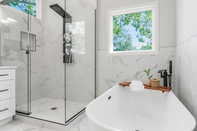 2201 W 74th St, Prairie Village, KS 66208 - full bath with a marble finish shower, a freestanding bath, marble finish floors, and tile walls