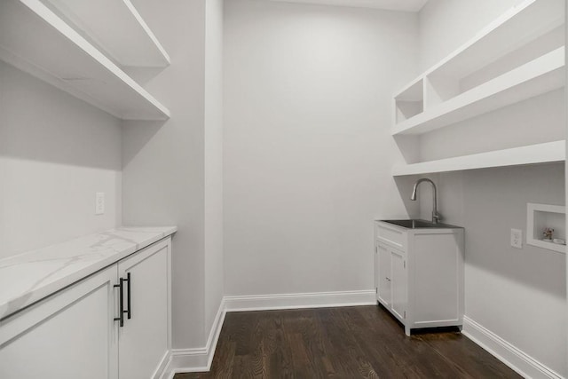 2201 W 74th St, Prairie Village, KS 66208 - laundry area featuring washer hookup, dark wood-type flooring, and cabinet space