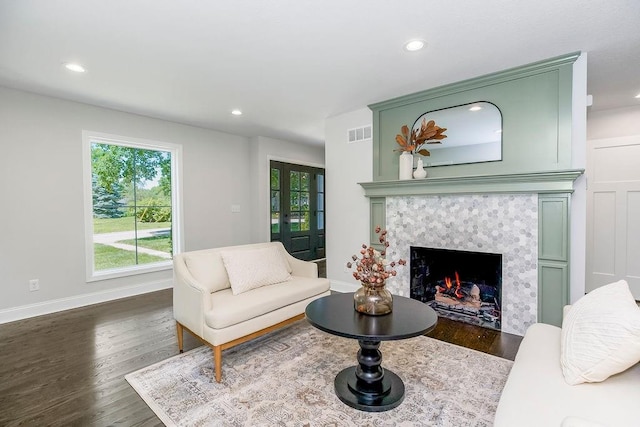 2201 W 74th St, Prairie Village, KS 66208 - living room with dark wood-style floors, recessed lighting, and a premium fireplace