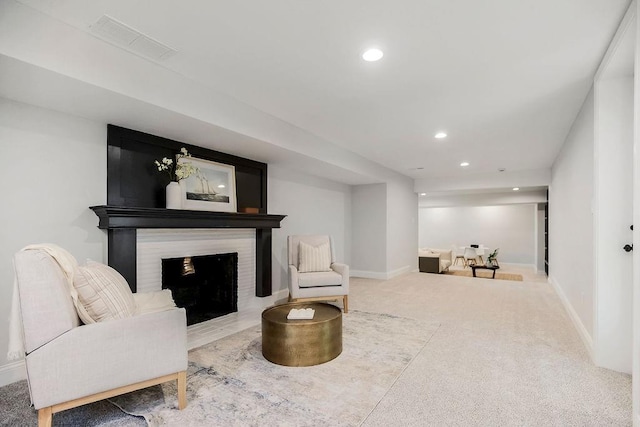 2201 W 74th St, Prairie Village, KS 66208 - living area featuring recessed lighting, a fireplace with flush hearth, and carpet floors