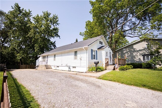 1619 W College St, Independence, MO 64050 - view of front of home with gravel driveway