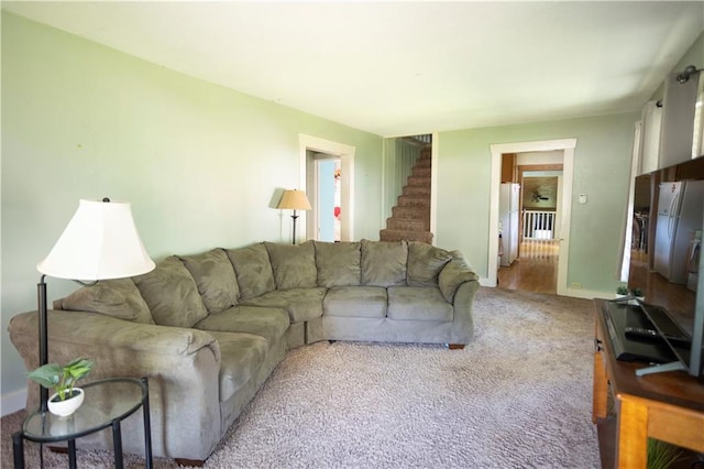 1619 W College St, Independence, MO 64050 - living area with stairs, carpet flooring, and radiator