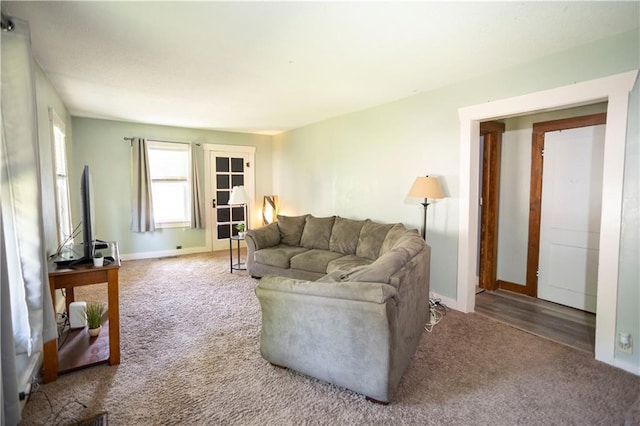 1619 W College St, Independence, MO 64050 - living area with carpet flooring and baseboards