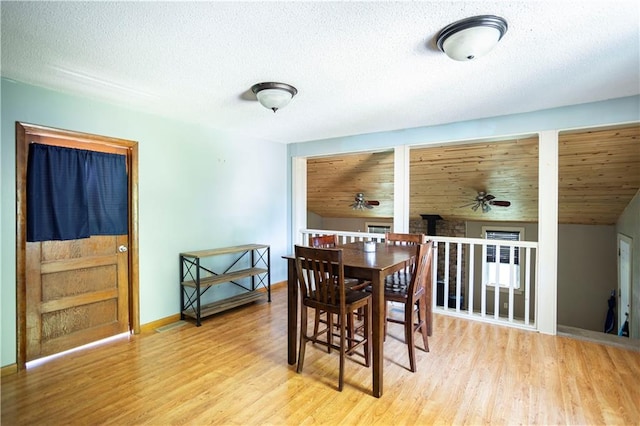 1619 W College St, Independence, MO 64050 - dining area with a ceiling fan, wood finished floors, and a textured ceiling