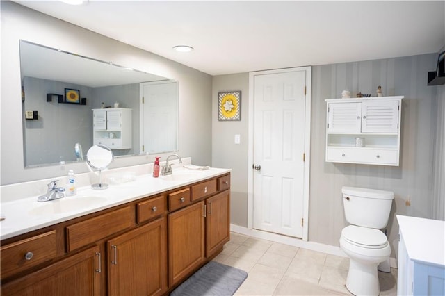 1619 W College St, Independence, MO 64050 - bathroom featuring double vanity and tile patterned flooring
