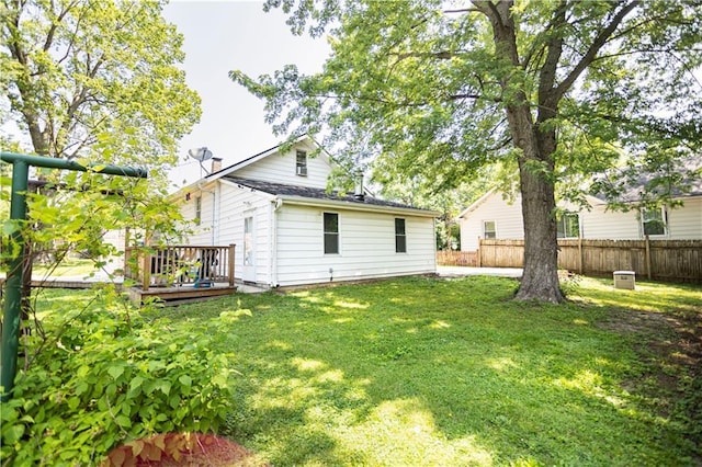 1619 W College St, Independence, MO 64050 - back of property with a wooden deck