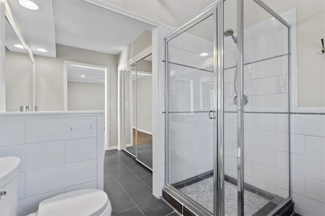 11412 Foster St, Overland Park, KS 66210 - full bathroom featuring a shower stall, recessed lighting, and vanity