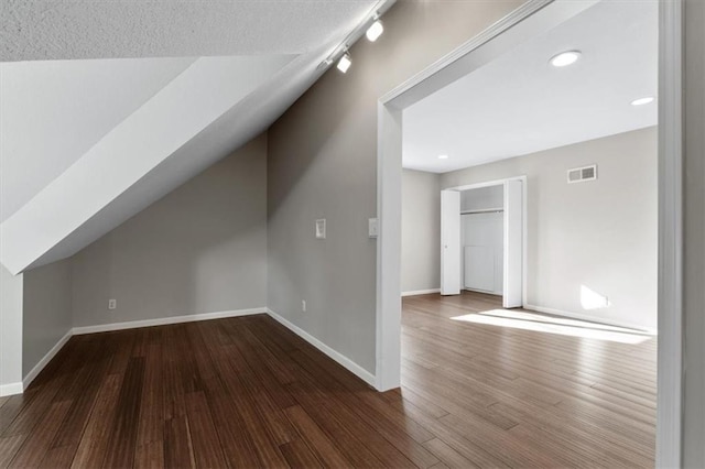 11412 Foster St, Overland Park, KS 66210 - bonus room with dark wood-style flooring and recessed lighting
