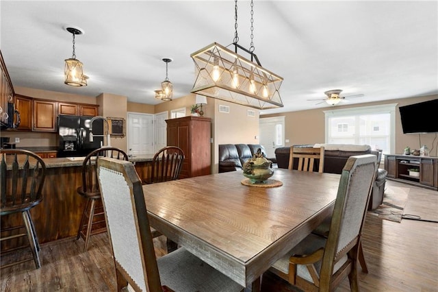 12318 N Wayne Ave, Kansas City, MO 64165 - dining area featuring dark wood-type flooring and a ceiling fan