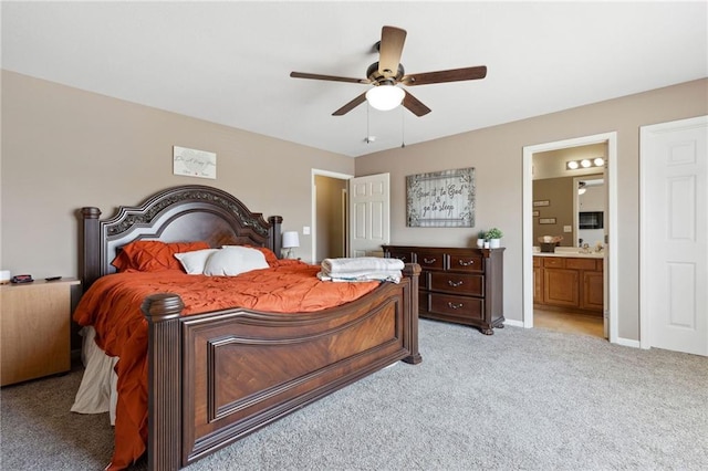 12318 N Wayne Ave, Kansas City, MO 64165 - bedroom with light carpet, ensuite bath, and ceiling fan