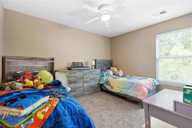 12318 N Wayne Ave, Kansas City, MO 64165 - carpeted bedroom featuring a ceiling fan