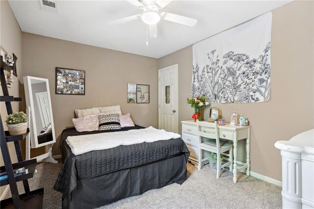 12318 N Wayne Ave, Kansas City, MO 64165 - carpeted bedroom featuring baseboards and a ceiling fan