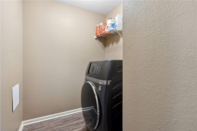 12318 N Wayne Ave, Kansas City, MO 64165 - laundry room featuring washer / dryer and wood finished floors