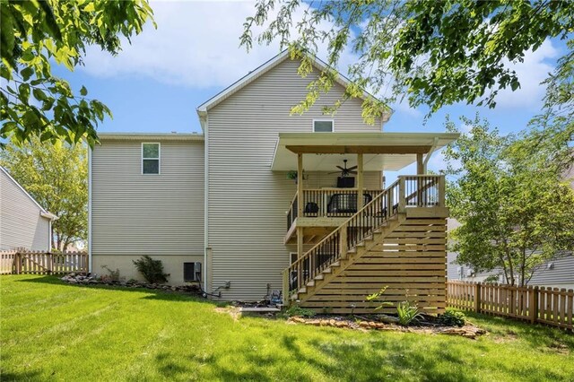 12318 N Wayne Ave, Kansas City, MO 64165 - rear view of property with a ceiling fan, a fenced backyard, and stairs