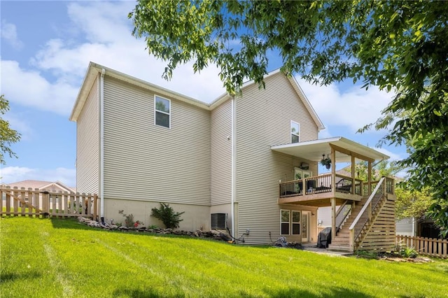 12318 N Wayne Ave, Kansas City, MO 64165 - rear view of house featuring stairway and a wooden deck