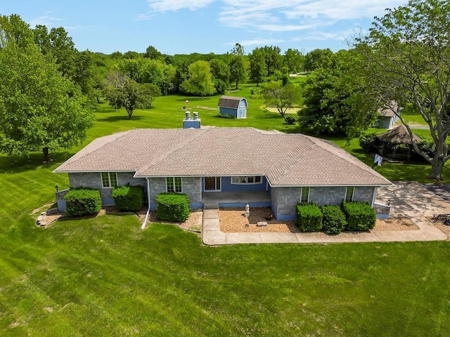 18209 E Moorland St, Pleasant Hill, MO 64080 - rear view of property with a yard, a shed, and stone siding
