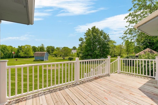 18209 E Moorland St, Pleasant Hill, MO 64080 - wooden terrace featuring a storage unit, a yard, and view of scattered trees