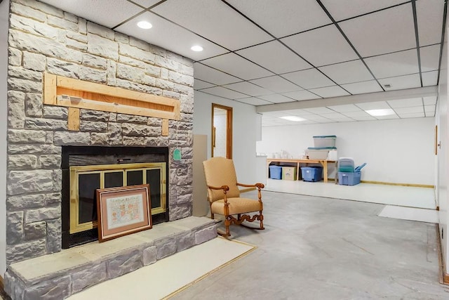 18209 E Moorland St, Pleasant Hill, MO 64080 - living area with a fireplace, a drop ceiling, concrete floors, and recessed lighting