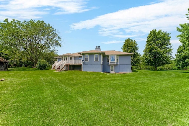 18209 E Moorland St, Pleasant Hill, MO 64080 - rear view of house featuring stairway, a yard, and a deck
