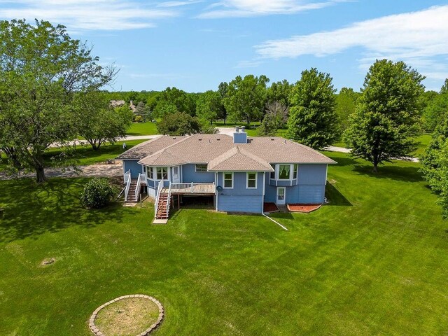 18209 E Moorland St, Pleasant Hill, MO 64080 - back of property featuring a deck, stairway, a lawn, and roof with shingles