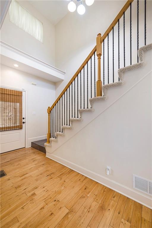 1905 160th St, Basehor, KS 66007 - entryway with wood-type flooring and stairs