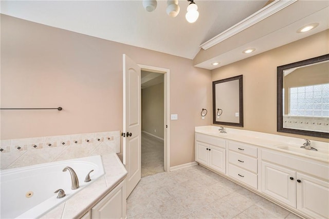 1905 160th St, Basehor, KS 66007 - full bathroom featuring a jetted tub, lofted ceiling, double vanity, and tile patterned flooring