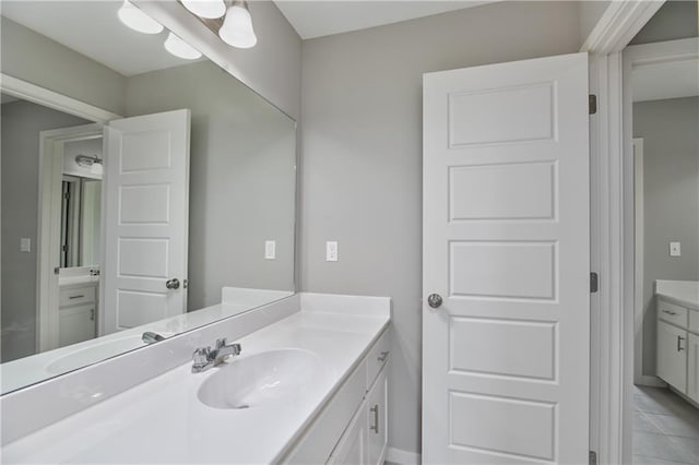 6102 Lewis Dr, Shawnee, KS 66226 - bathroom featuring vanity and tile patterned floors