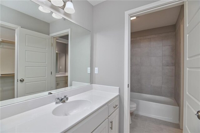6102 Lewis Dr, Shawnee, KS 66226 - full bathroom featuring tile patterned flooring, vanity, and shower / bath combination
