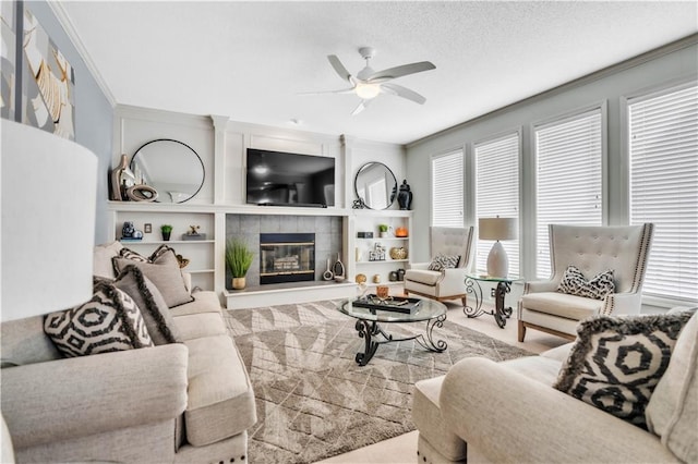 8007 W 131st Ter, Overland Park, KS 66213 - living area with ceiling fan, a tiled fireplace, ornamental molding, and built in features