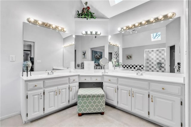 8007 W 131st Ter, Overland Park, KS 66213 - bathroom featuring a skylight, lofted ceiling, and double vanity