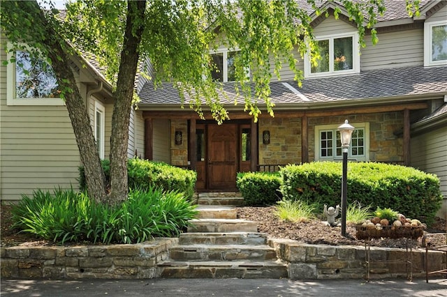 12635 W 183rd St, Overland Park, KS 66013 - view of front of house featuring a porch, stone siding, and a shingled roof