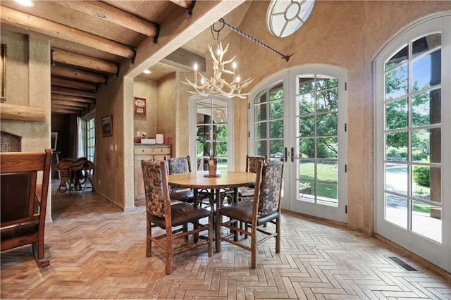 12635 W 183rd St, Overland Park, KS 66013 - dining room featuring french doors, healthy amount of natural light, beam ceiling, a chandelier, and a towering ceiling