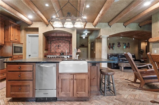 12635 W 183rd St, Overland Park, KS 66013 - kitchen featuring brick flooring, dark countertops, stainless steel appliances, beam ceiling, and recessed lighting