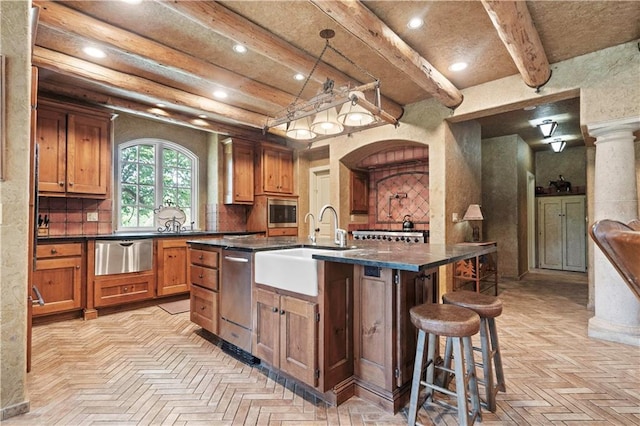 12635 W 183rd St, Overland Park, KS 66013 - kitchen featuring dark countertops, recessed lighting, a warming drawer, beam ceiling, and a kitchen bar