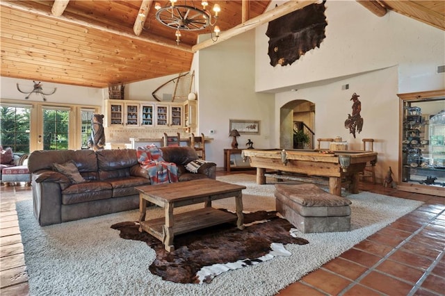 12635 W 183rd St, Overland Park, KS 66013 - living room with a wood ceiling with exposed beams, high vaulted ceiling, a chandelier, pool table, and tile patterned floors