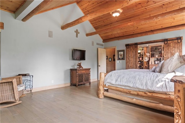 12635 W 183rd St, Overland Park, KS 66013 - bedroom with a barn door, a wood ceiling with exposed beams, wood finished floors, and high vaulted ceiling