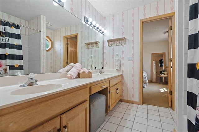 12635 W 183rd St, Overland Park, KS 66013 - ensuite bathroom with a textured ceiling, wallpapered walls, double vanity, tile patterned flooring, and curtained shower