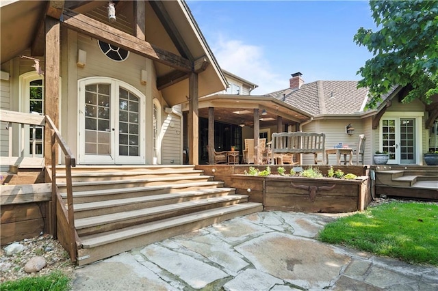 12635 W 183rd St, Overland Park, KS 66013 - entrance to property featuring french doors, a patio, ceiling fan, and a chimney