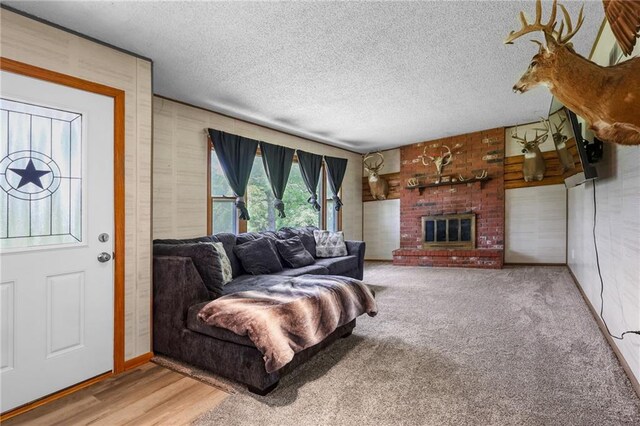 39103 New Lancaster Rd, Lacygne, KS 66040 - living room with a textured ceiling and a brick fireplace