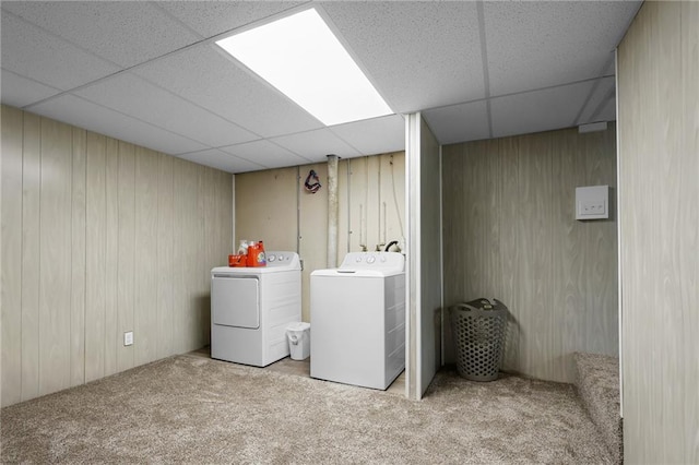 39103 New Lancaster Rd, Lacygne, KS 66040 - laundry room with carpet floors, washing machine and dryer, and wooden walls