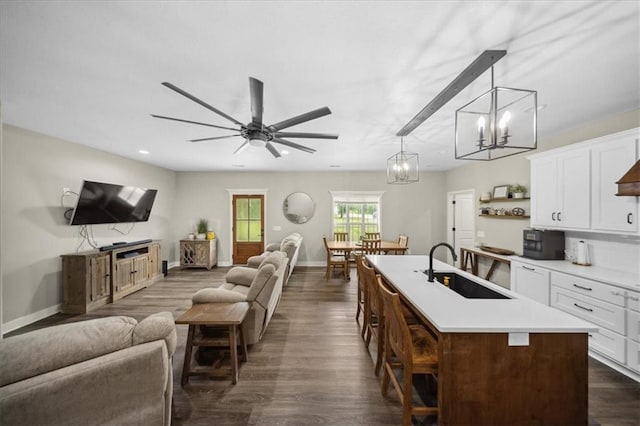 6401 SE Hamilton Rd, Holt, MO 64048 - living room featuring a chandelier, dark wood finished floors, a ceiling fan, and recessed lighting